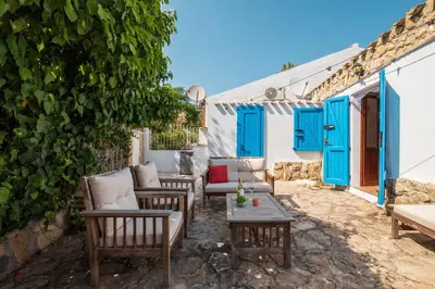 Area soggiorno di Mandorletti Essence - Private Courtyard & Nature