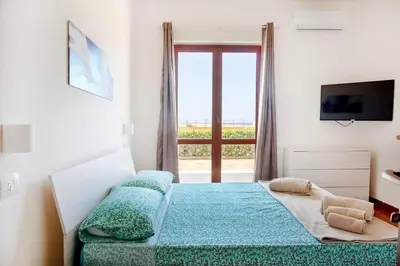 Letto o letti in una camera di Seafront Solanas