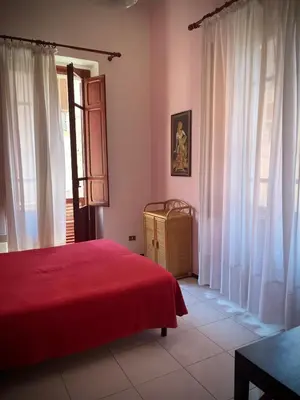 Letto o letti in una camera di B&B Casa Devoto Cagliari