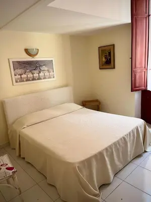 Letto o letti in una camera di B&B Casa Devoto Cagliari