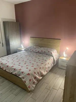 Letto o letti in una camera di Appartamento casa Dalia