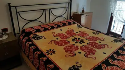 Letto o letti in una camera di Casa di Nonna