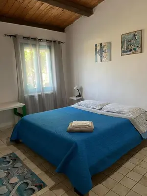 Letto o letti in una camera di Casa Mia