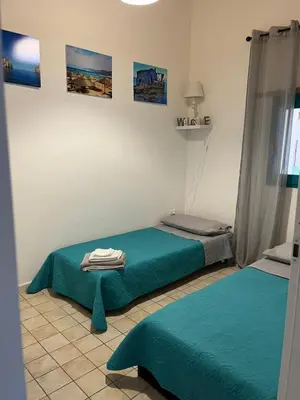 Letto o letti in una camera di Casa Mia