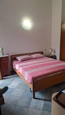 Letto o letti in una camera di Villetta SCORDALINNA