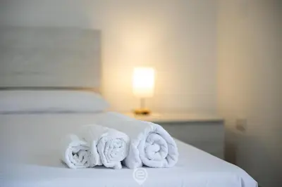 Letto o letti in una camera di Casa Elvira