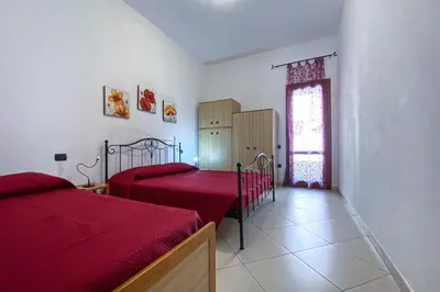 Letto o letti in una camera di Casa Savina