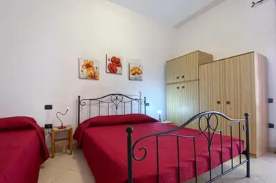 Letto o letti in una camera di Casa Savina