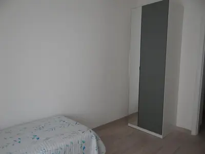 Letto o letti in una camera di Casa Cinzia con piccolo giardino
