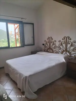 Letto o letti in una camera di casa relax a chia