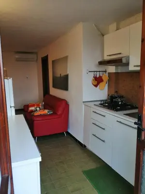 Cucina o angolo cottura di La terrazza sul blu - intero appartamento con vista Costa Rei