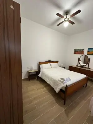Letto o letti in una camera di Appartamento con patio