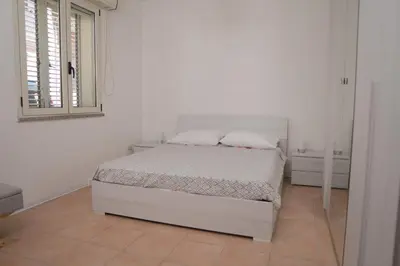 Letto o letti in una camera di Casa Lumiere
