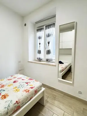 Letto o letti in una camera di PinHouse