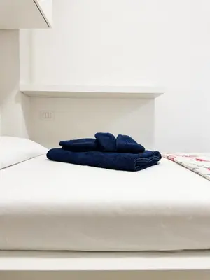 Letto o letti in una camera di PinHouse