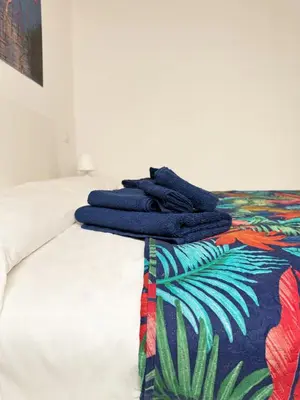 Letto o letti in una camera di PinHouse