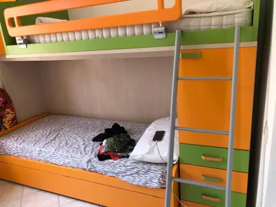 Letto o letti in una camera di Holiday Costa Rei