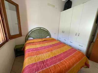 Letto o letti in una camera di Holiday Costa Rei