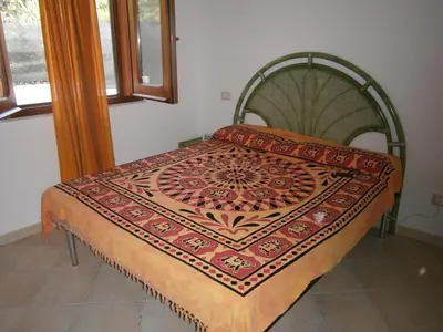Letto o letti in una camera di Holiday Costa Rei