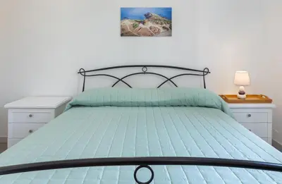 Letto o letti in una camera di GuestHost - Roby's Home