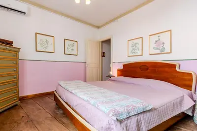 Letto o letti in una camera di GuestHost - La Meridiana