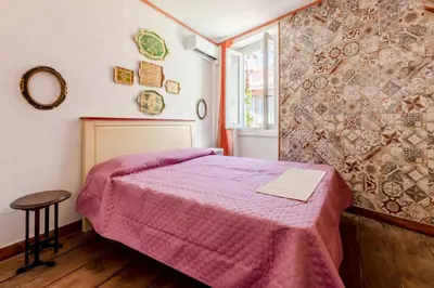 Letto o letti in una camera di GuestHost - La Meridiana