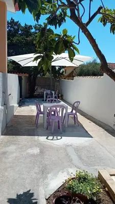 Patio o area all'aperto di L'oasi - Monolocale con giardino in Sardegna