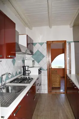 Cucina o angolo cottura di Villa Panoramica Vista Mare Costa Rei 3 Camere da letto