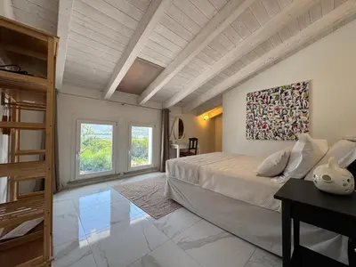 Letto o letti in una camera di Tenuta Feraxi - Private Paradise
