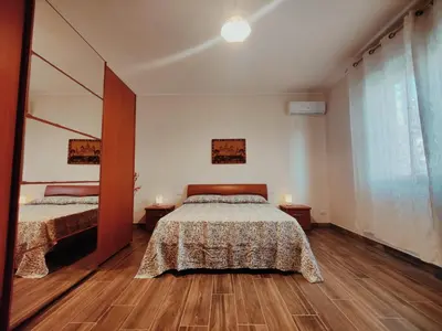 Letto o letti in una camera di Casa Luisella