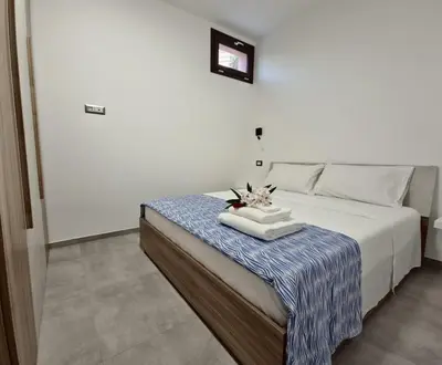 Letto o letti in una camera di Maristella