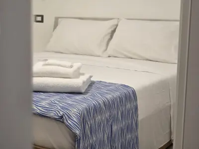 Letto o letti in una camera di Maristella