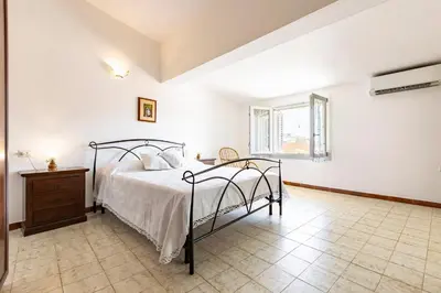 Letto o letti in una camera di GuestHost - Casa Suentu