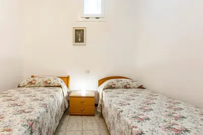 Letto o letti in una camera di GuestHost - Casa Suentu