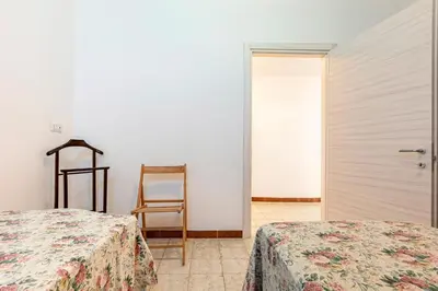 Letto o letti in una camera di GuestHost - Casa Suentu