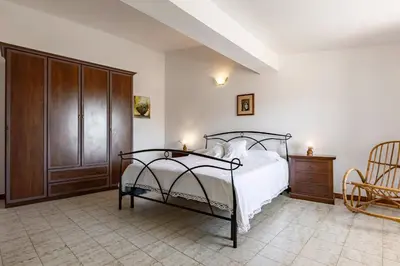 Letto o letti in una camera di GuestHost - Casa Suentu
