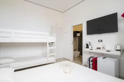 Letto o letti in una camera di EnSe Affittacamere