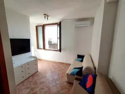 TV o dispositivi per l'intrattenimento presso ENJOY HOUSE SARDINIA vista mare
