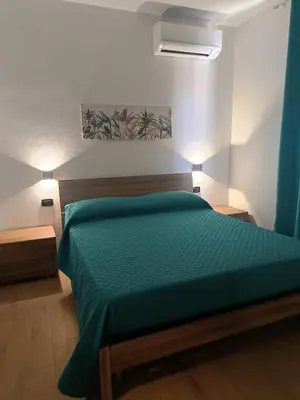 Letto o letti in una camera di Casa Tiddia