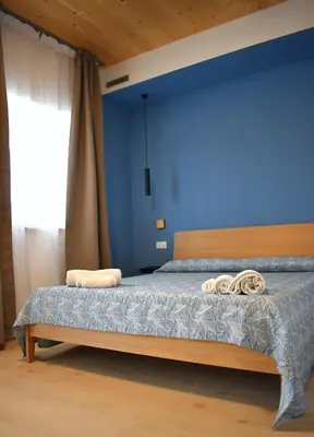Letto o letti in una camera di La Casa di Legno