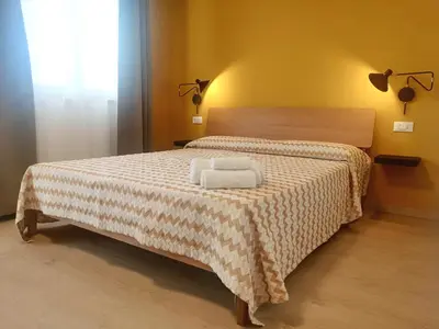 Letto o letti in una camera di La Casa di Legno