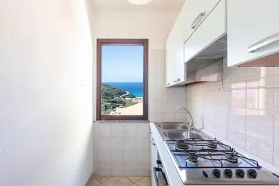 Cucina o angolo cottura di [Costa Verde - Panoramic Stay] Terrace Wifi BBQ AC
