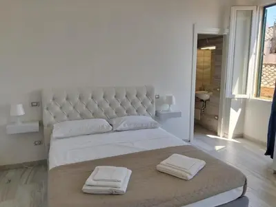 Letto o letti in una camera di Suite Palazzo Siotto