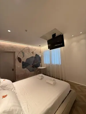 Letto o letti in una camera di Saretta Luxury Suites
