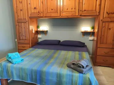 Letto o letti in una camera di Su Cracinaiu