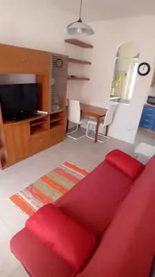 TV o dispositivi per l'intrattenimento presso Donigala Fenughedu Apartment