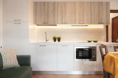 Cucina o angolo cottura di Su Scannu - Stylish Beach apartment with Lounge terrace