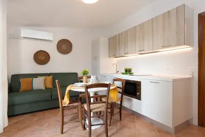 Cucina o angolo cottura di Su Scannu - Stylish Beach apartment with Lounge terrace