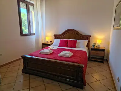 Letto o letti in una camera di Teresa