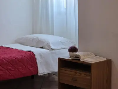 Letto o letti in una camera di Teresa